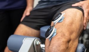 electrical muscle stimulation (EMS) therapy on leg with Compex