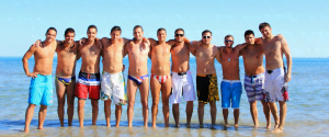 group of men standing on beach